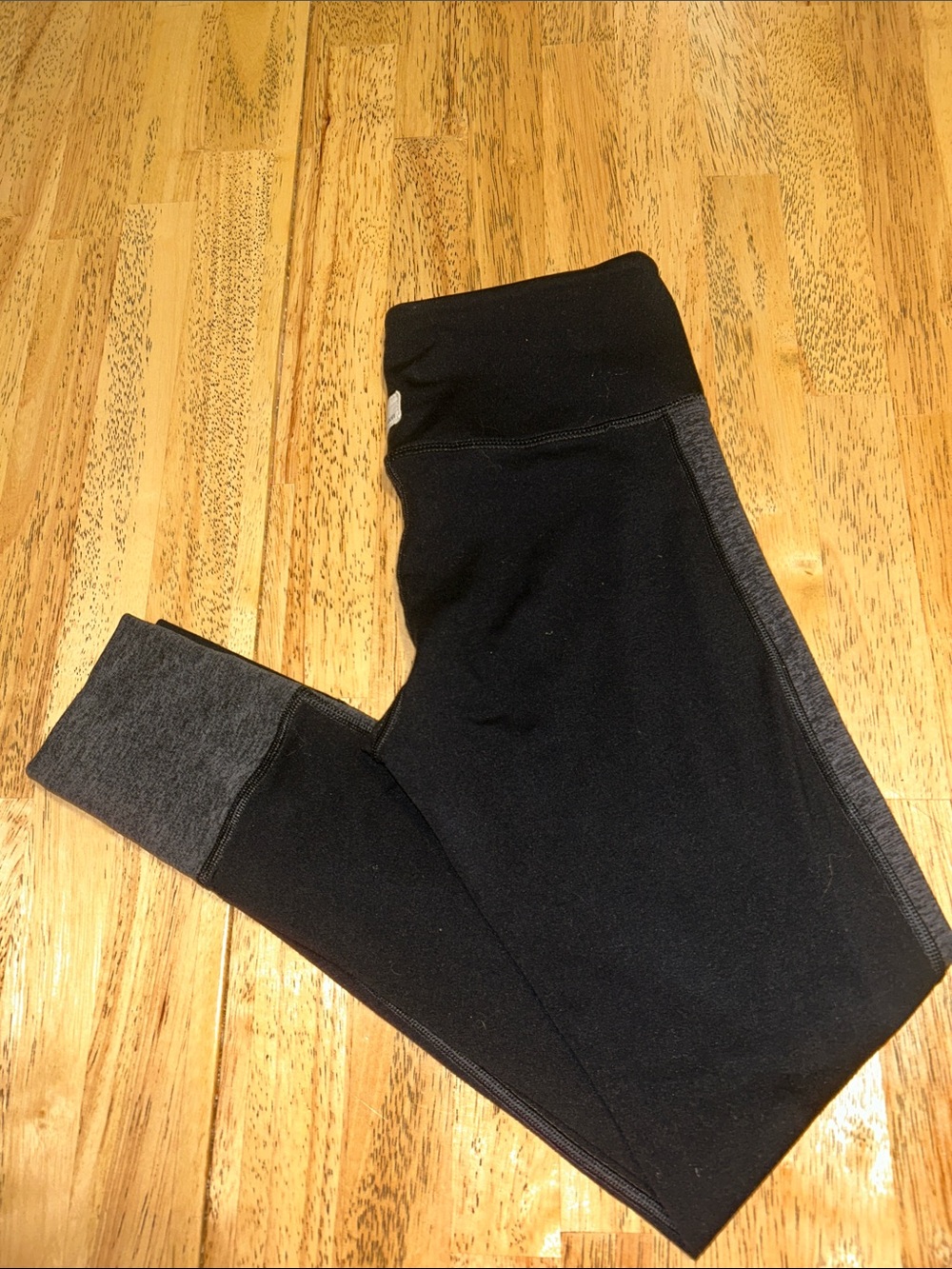 Vuori Racer Stripe Leggings in a black and grey colorway